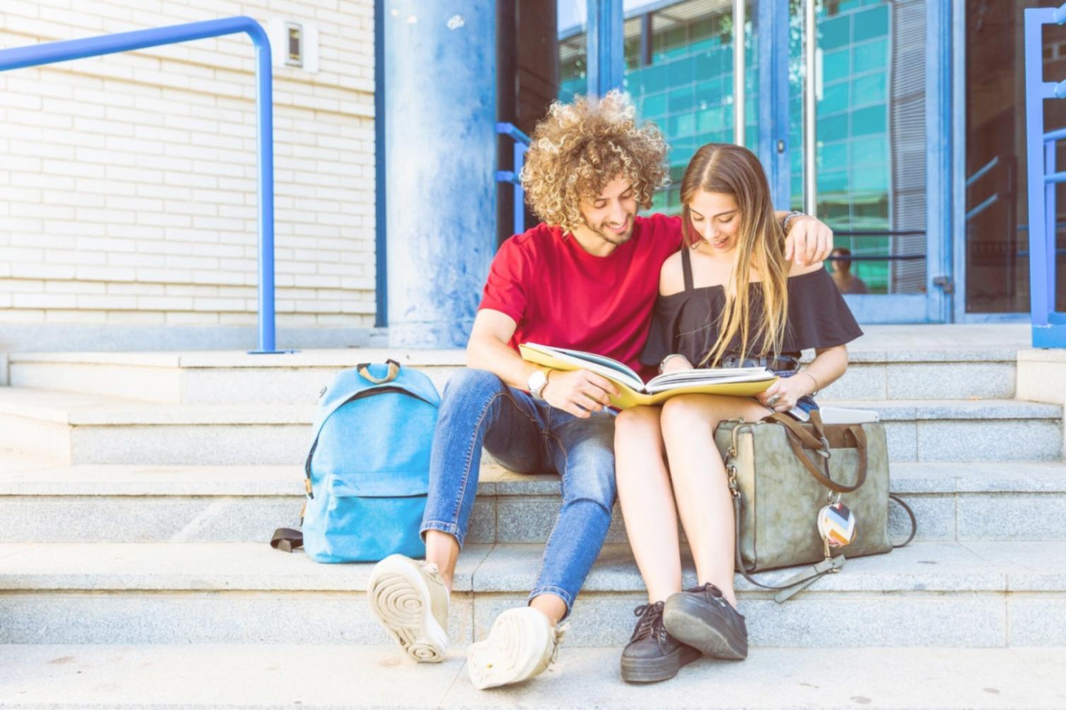 Professional reviewing budget presentation materials on desk with charts and documents